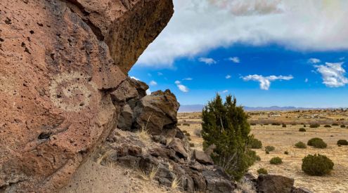 A petroglyph is seen on a rock formation in the Caja Del Rio landscape