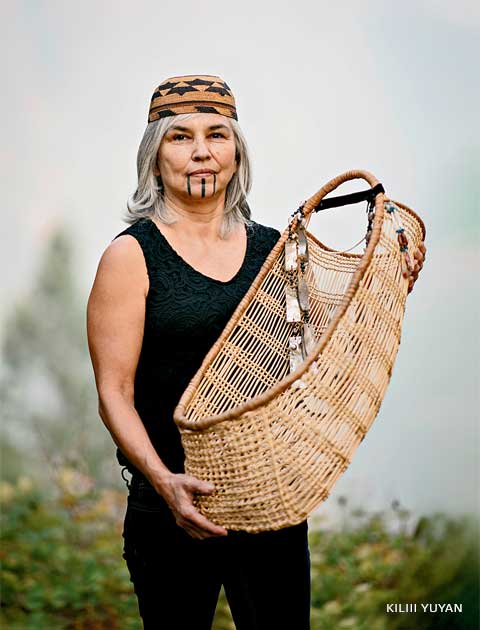 Robbins (above left) leads others in lighting bundles of wormwood—a ceremonial start to a cultural burn near Weitchpec, California. A burn near the town of Orleans (below) reduces potential wildfire fuel on the forest floor. 